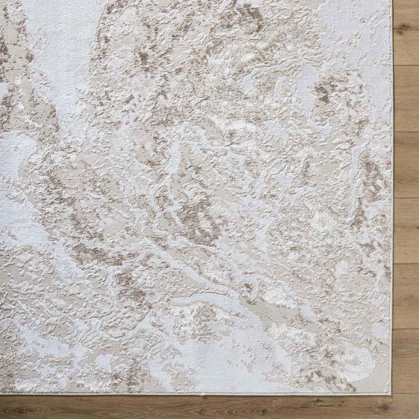 Close-up of the Kaleo Area Rug. Beige, cream, and tan abstract pattern. Contemporary style. Polyester material. Corner