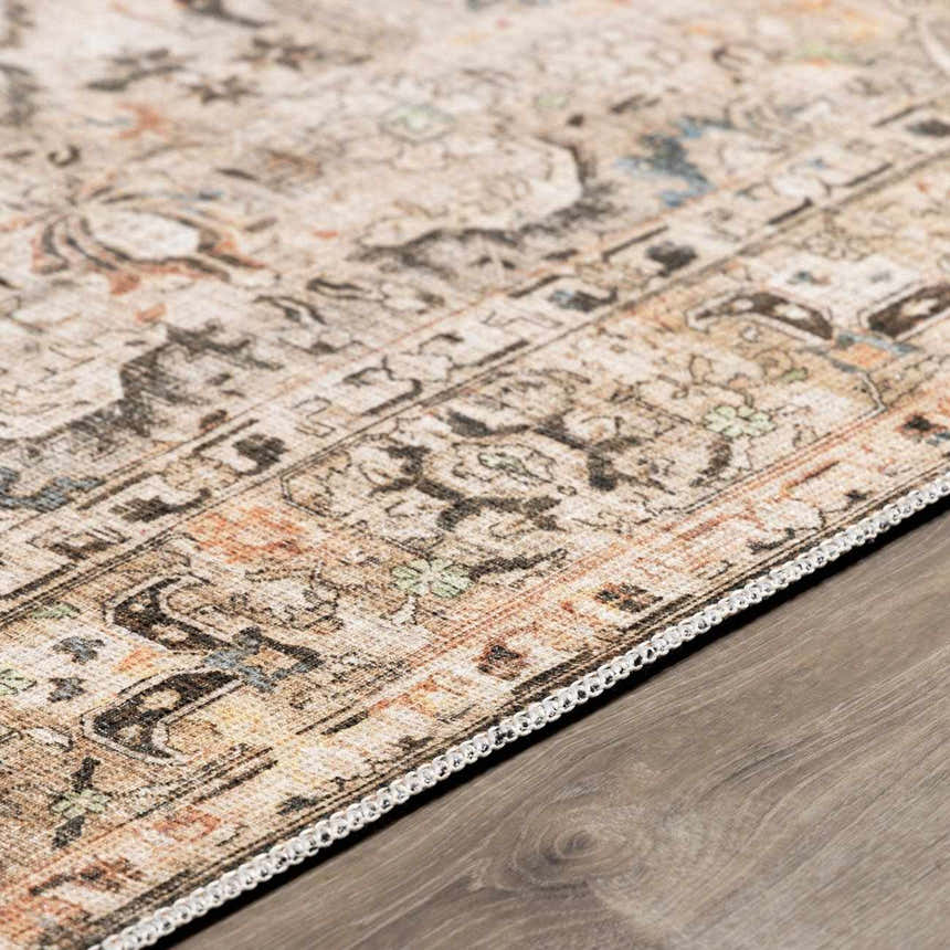 Close-up of a Standon Vintage Flat Pile Washable Rug showing its Persian-style pattern and neutral colors with blue, orange, and green accents. Pile