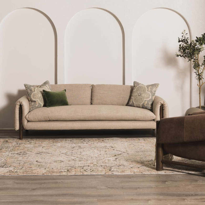 Living room scene with a beige sofa and Standon Vintage Flat Pile Washable Rug in neutral tones. Roomscene-Rectangle