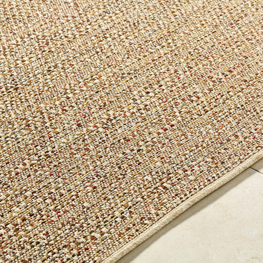 Close-up of the Thanh Beige Area Rug showing its woven texture and beige, coral, and mustard color details. Texture