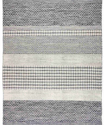 Close-up of the Tideswell Scandi Boho Wool Carpet. Beige rug with black geometric patterns and hand-woven texture. Design-Rectangle