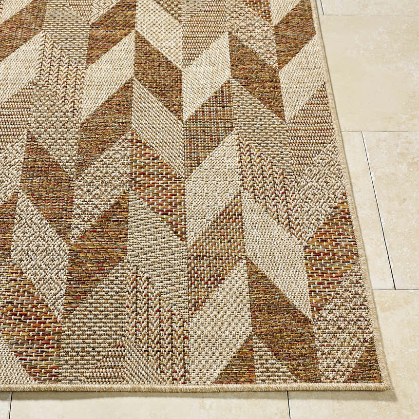 Close-up of the Andrea Burnt Sienna Area Rug, showcasing its geometric pattern and beige, rust, and terracotta tones. Front