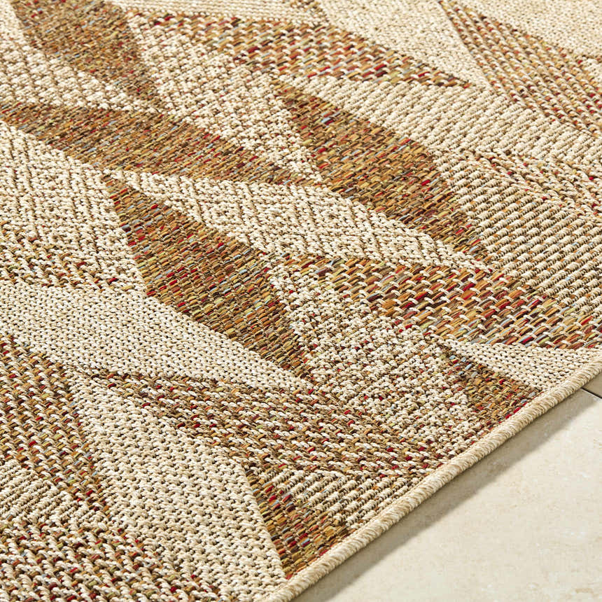 Close-up of the Andrea Burnt Sienna Area Rug showing beige, rust, and terracotta woven geometric pattern and texture. Texture