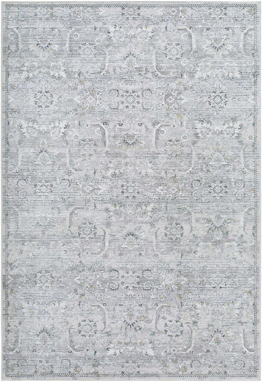 Close-up of the Tariq Area Rug. Machine-woven with a traditional floral pattern in silver gray, slate blue, and sterling gray. Design-Rectangle-537
