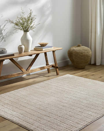 Entryway with a Cascade Dark Beige Area Rug, wood bench, vases, and woven basket for a farmhouse feel. Roomscene-Rectangle