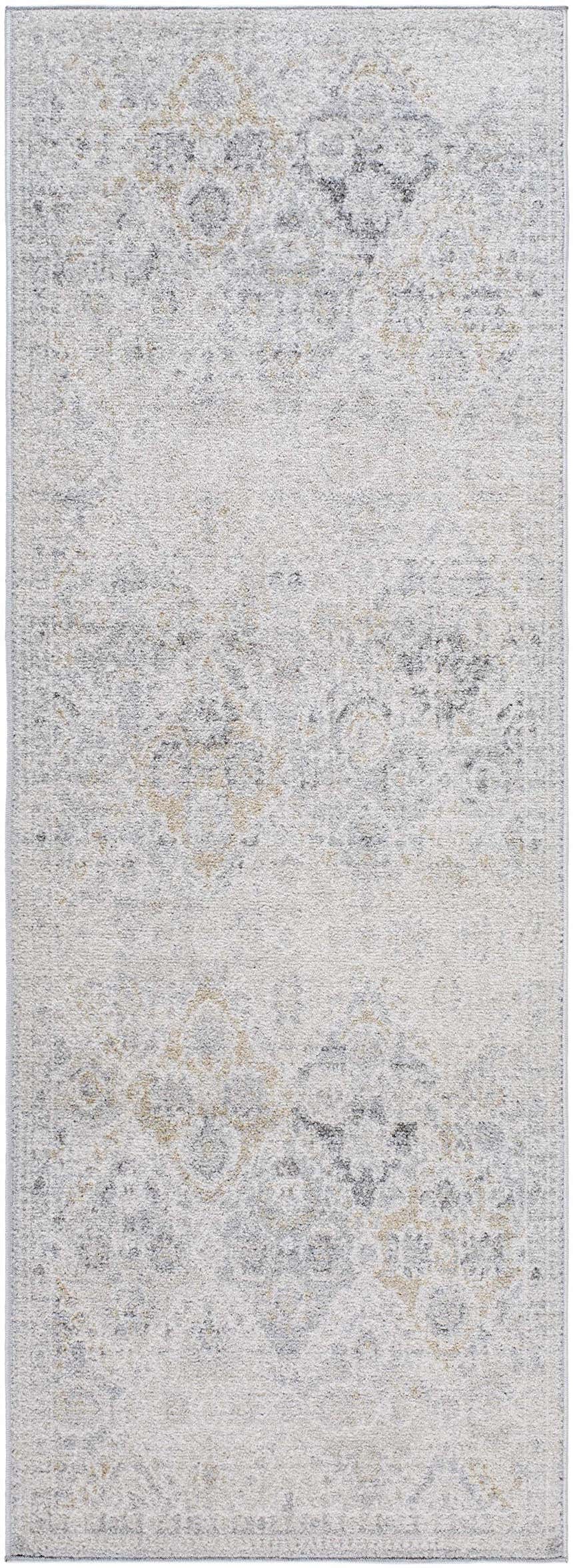 Close-up of the Totsi Area Rug, a machine-woven rug with farmhouse style in blue, charcoal, cream, gray, mustard, and peach. Design-Runner-2773