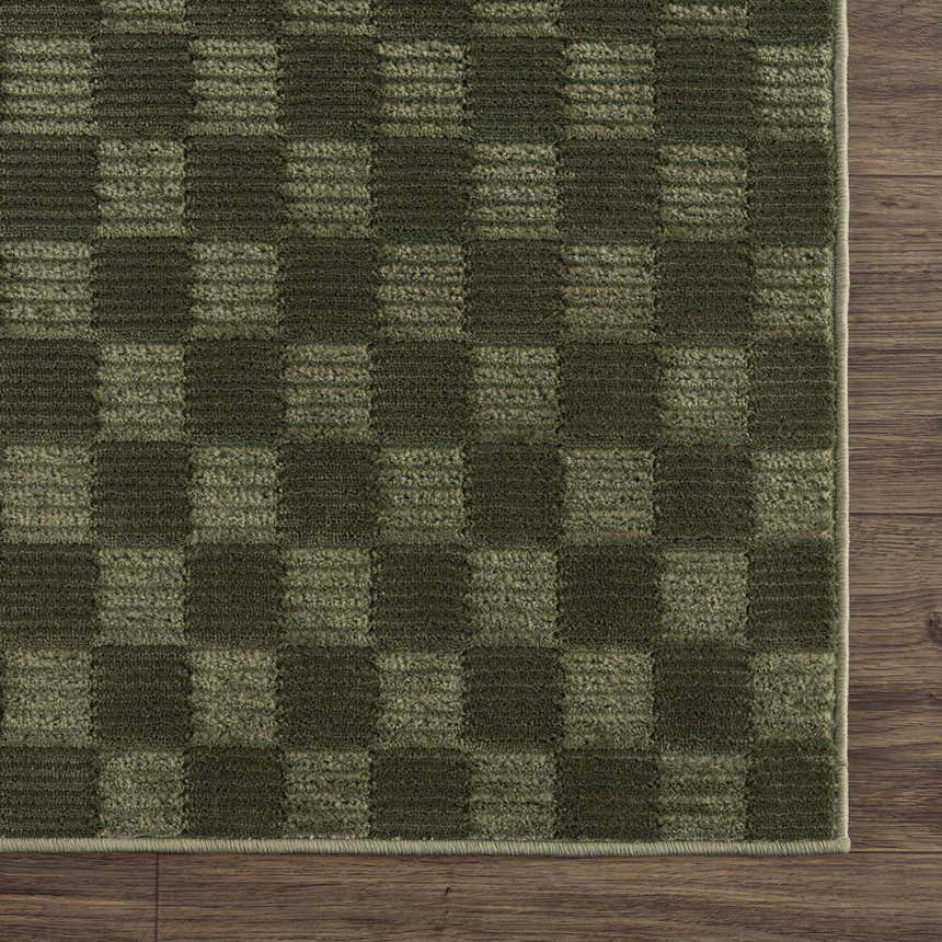 Close-up of the Truls 3D Checkered Washable Rug - Green, showcasing its textured, two-tone green checkered pattern. Swatch