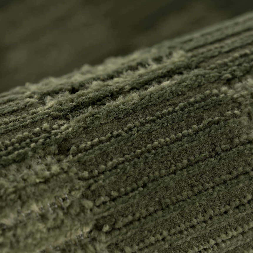 Close-up of the textured, green Truls 3D Checkered Washable Rug. Machine woven polyester rug. Fold