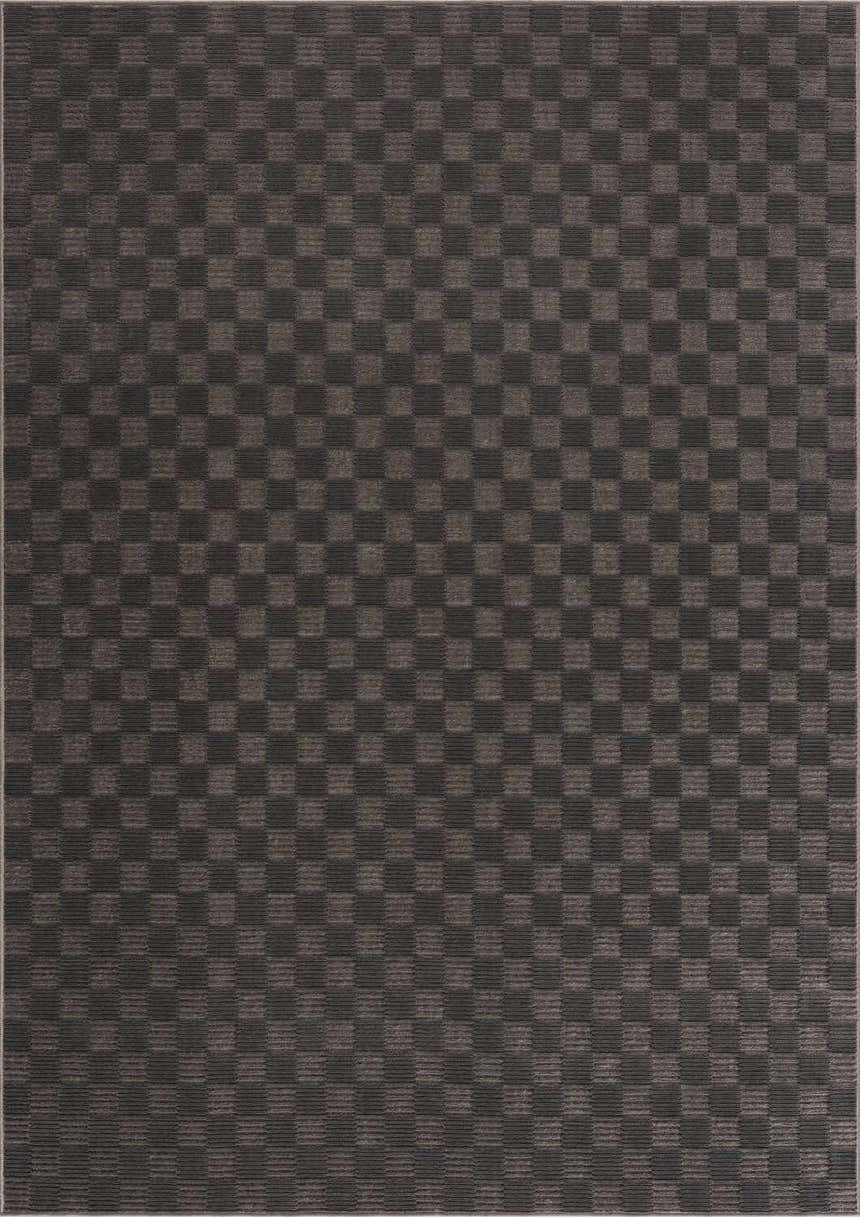 Close-up of the Truls 3D Checkered Washable Rug in Black and Gray. Features a textured, checkered pattern. Design-Rectangle-5373