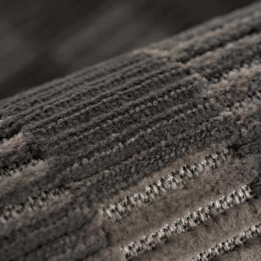 Close-up of the black Truls 3D Checkered Washable Rug, showing the textured, geometric pattern. Fold