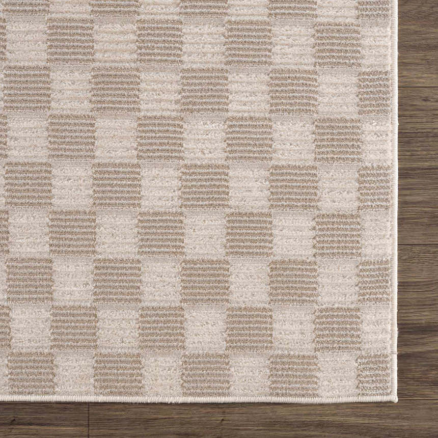Close-up of the Truls 3D Checkered Washable Rug in Biscotti. Beige and cream checkered pattern. Machine woven polyester rug. Swatch