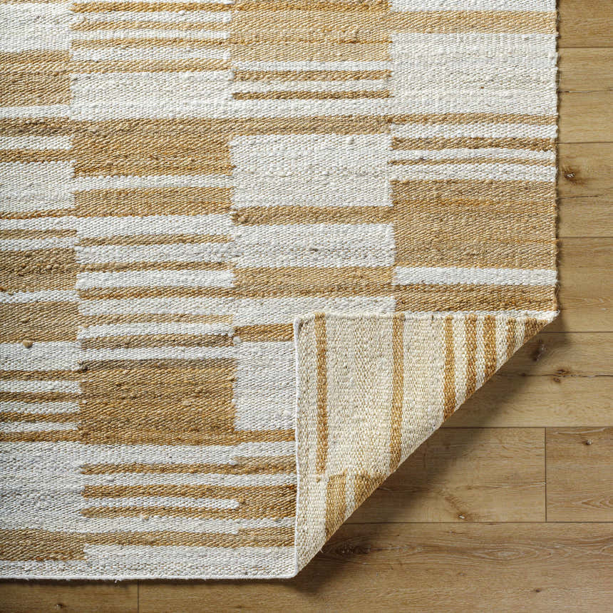 Close-up of the Kamey Handmade Becki Owens x LIVABLISS BOKY-2307 Area Rug showing ivory, sandstone, and yellow jute texture. Fold
