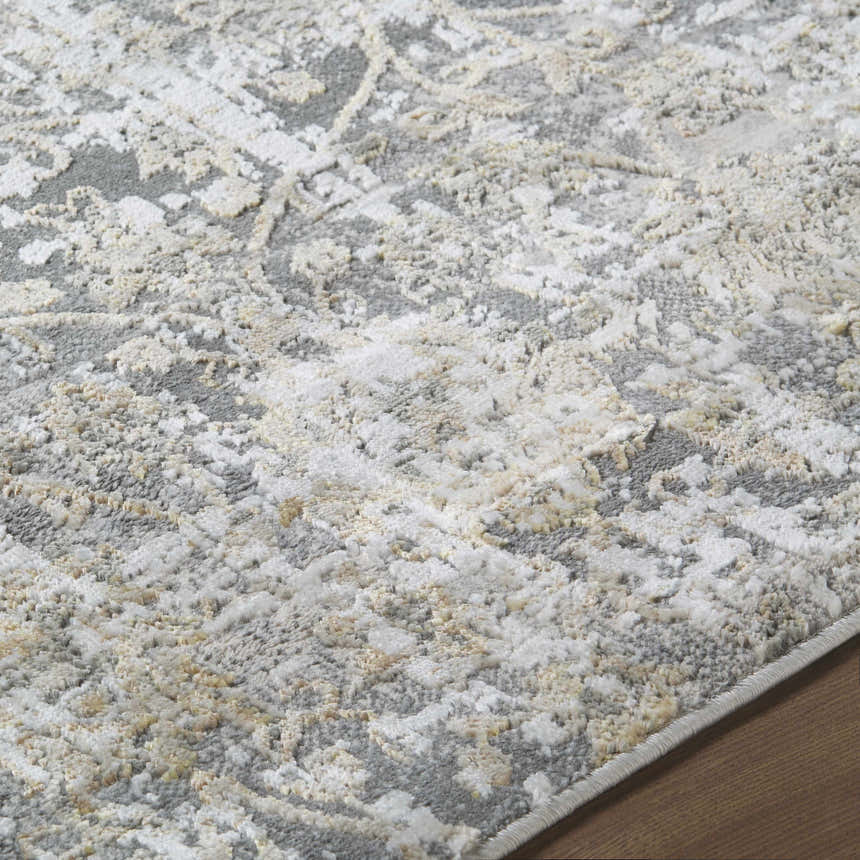 Close-up of the Tiago Area Rug; beige, charcoal, cream, and gray contemporary design. Texture