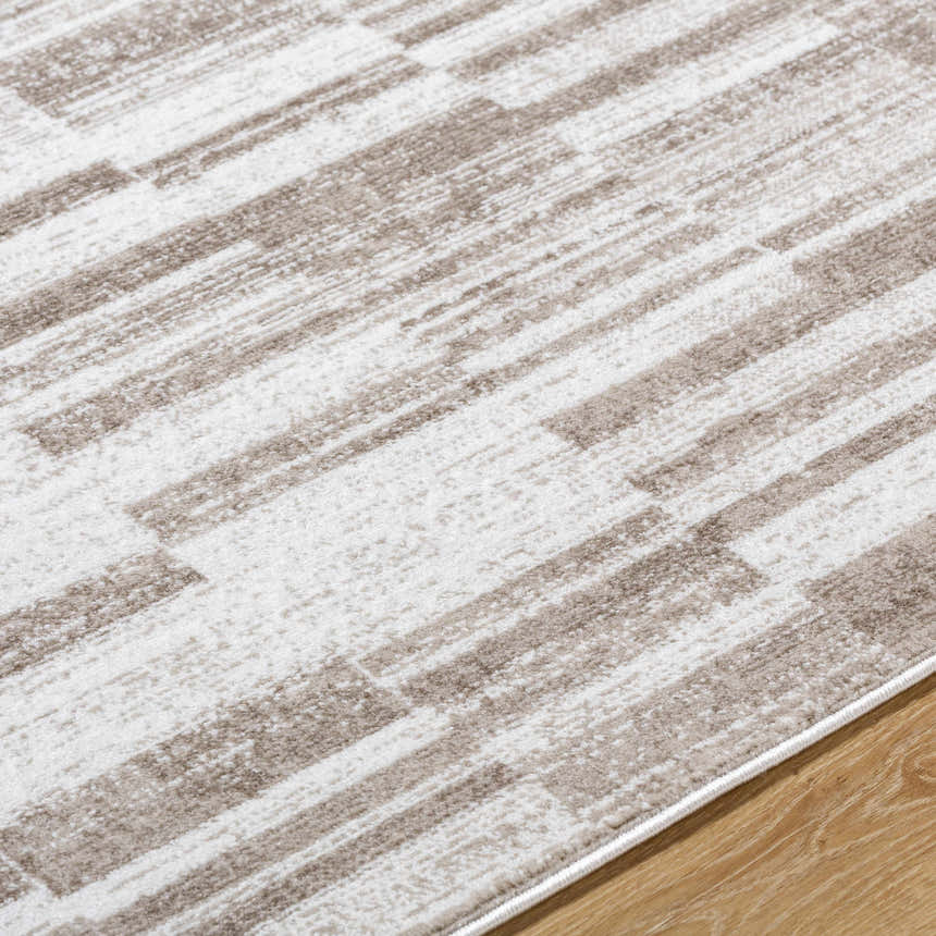 Close up of the Tehya Beige Area Rug showing its contemporary light silver and sage block pattern. Texture