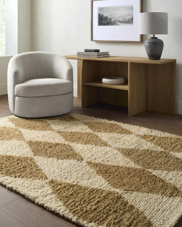 Living room scene with a beige Tivka Diamond Checkered Wool Rug, light brown wood console table, and a cozy swivel chair. Roomscene-Rectangle