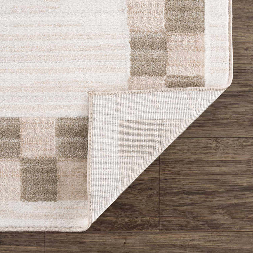 Close-up of Azrika Beige Checkered Washable Rug showing beige and brown geometric pattern and non-slip backing. Fold