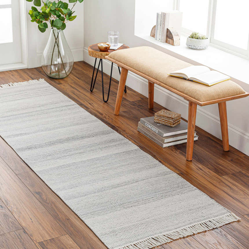 Entryway with Villasis Area Rug runner in gray and beige, wood bench, and hardwood floors. Scandinavian style. Roomscene-Runner