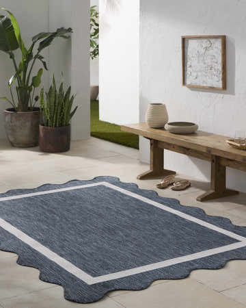 Entryway with a Varro Navy Area Rug, wooden bench, plants, and neutral decor. Farmhouse style. Roomscene-Rectangle