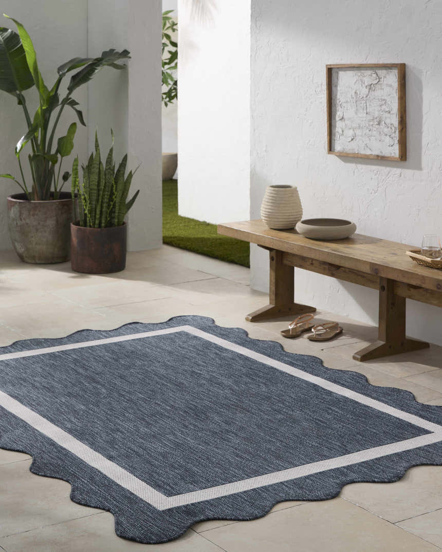 Entryway with a Varro Navy Area Rug, wooden bench, plants, and neutral decor. Farmhouse style. Roomscene-Rectangle