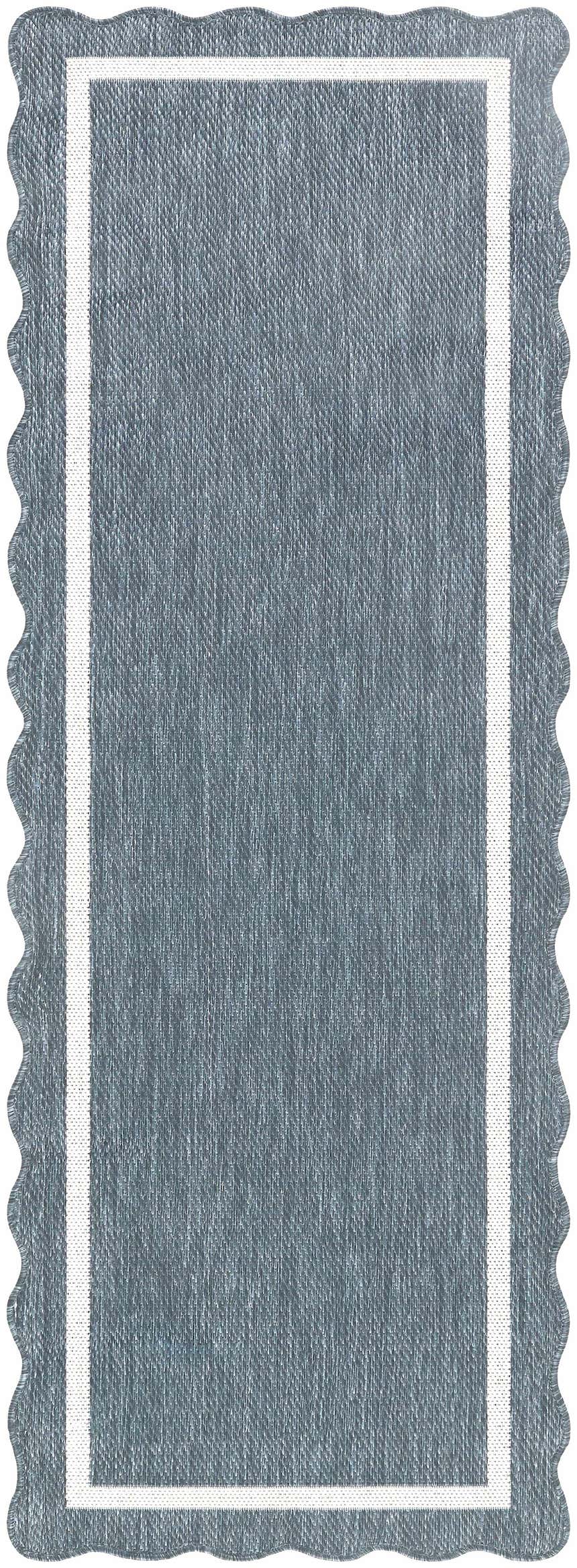 Close-up of the Varro Blue Area Rug. Features a blue woven texture, cream border, and a scalloped edge. Design-Runner-2773