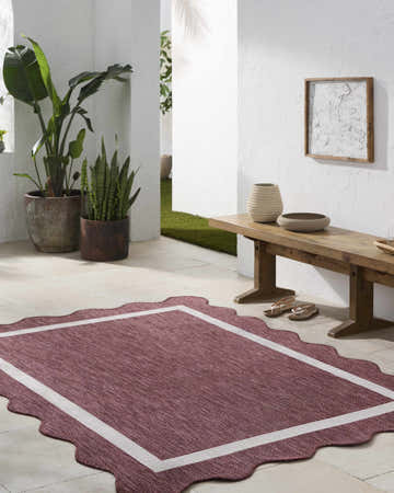 Hallway scene with a Varro Burgundy Area Rug, wooden bench, plants, and neutral decor. Roomscene-Rectangle
