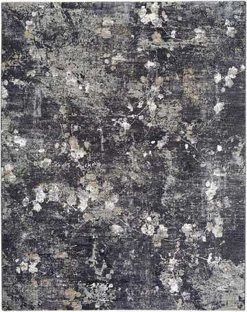 Close-up of Aquila Black Area Rug. Southwestern style rug in black, charcoal, gray, ivory, and tan with abstract floral pattern. Design-Rectangle-710102