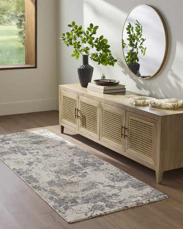 Entryway with wood floors and Aquila Cream Area Rug runner in front of a console table with decor. Roomscene-Runner