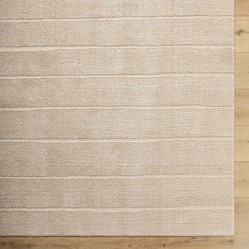 Close-up of the Cascade Brown Area Rug showing light brown, horizontal stripes, and soft, textured polyester pile. Swatch