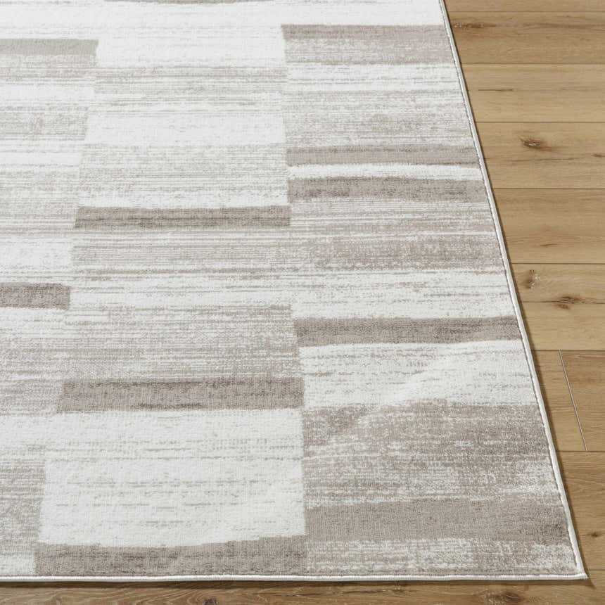 Close up of the Vasso Beige Area Rug showing a contemporary geometric pattern in light silver and warm gray. Front
