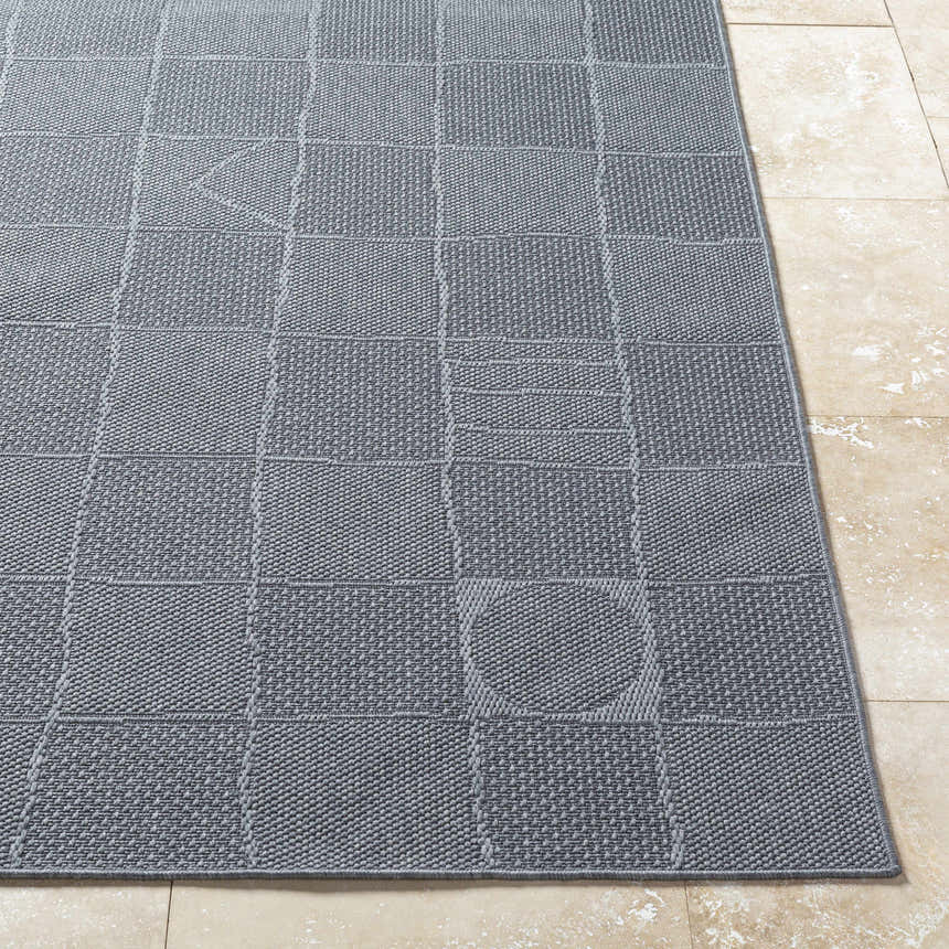 Close-up of the Veras Charcoal Area Rug showing its gray color, woven texture, and geometric pattern. Front