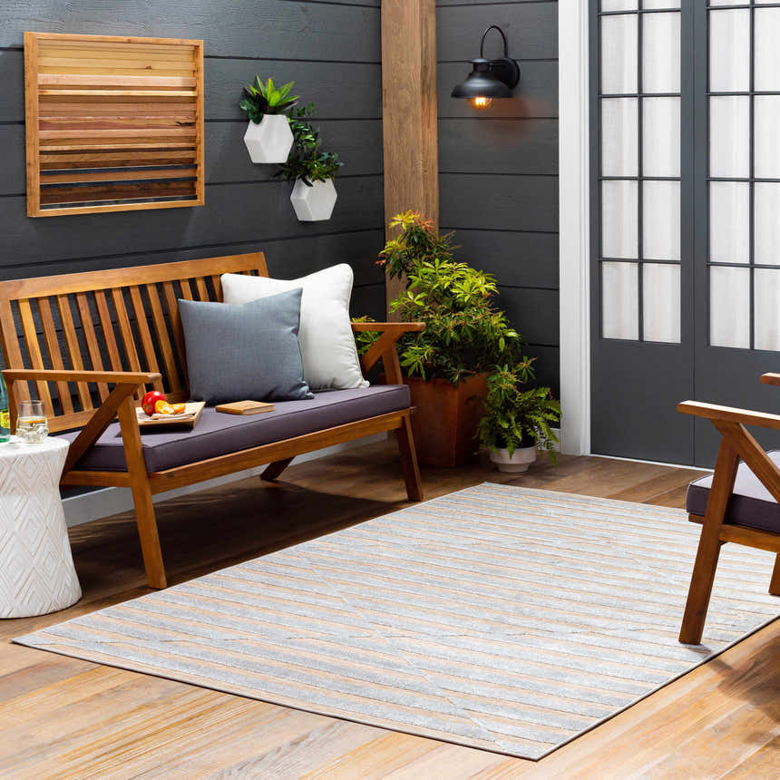 Cozy porch scene with Webuye 3D Outdoor Area Rug in dark gray and peach, wood bench, and potted plants. Roomscene-Rectangle