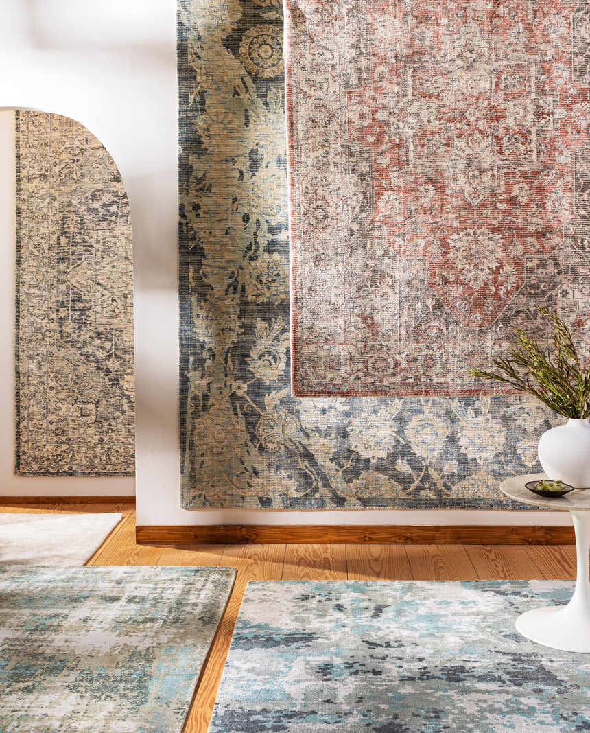 Tannersville Area Rugs displayed in a room scene, showcasing beige, teal, and sage colors and contemporary style. Styleshot