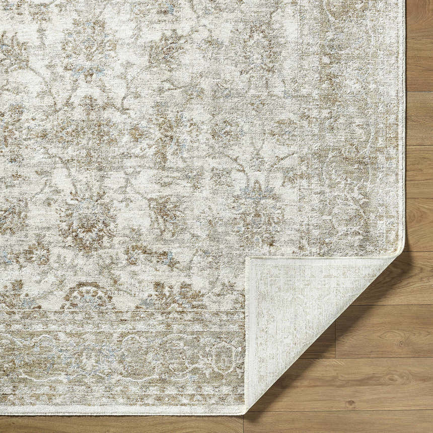Close-up of the Arella Area Rug showing its ivory, sandstone, and slate gray traditional floral pattern and texture. Fold