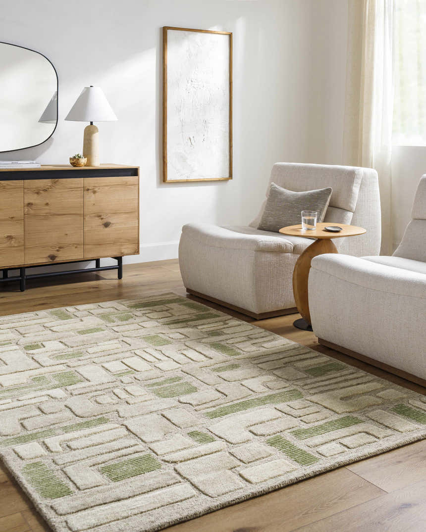 Living room scene with a neutral Alaqua area rug, light wood floors, and cream-colored chairs. Roomscene-Rectangle