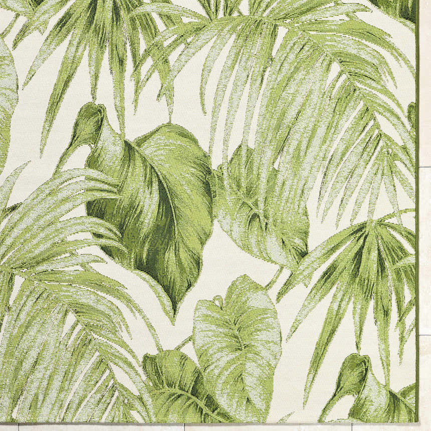 Close up of the Amirah Green Area Rug featuring an ivory base with a leafy olive pattern. Corner