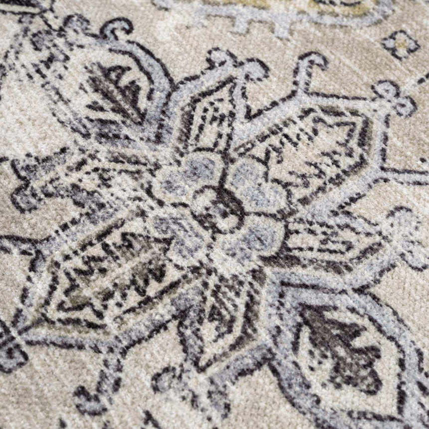 Close-up of Holi-4606 Washable Area Rug. Black and gold traditional vintage pattern on a farmhouse style rug. Texture