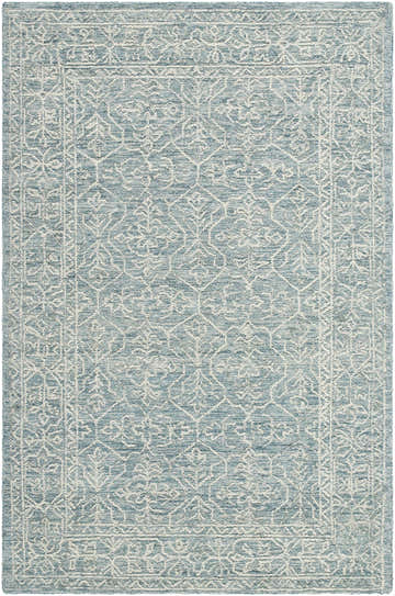 Close-up of the Yadid Area Rug. Hand-tufted wool rug in light blue with a traditional white floral pattern and border. Design-Rectangle-576