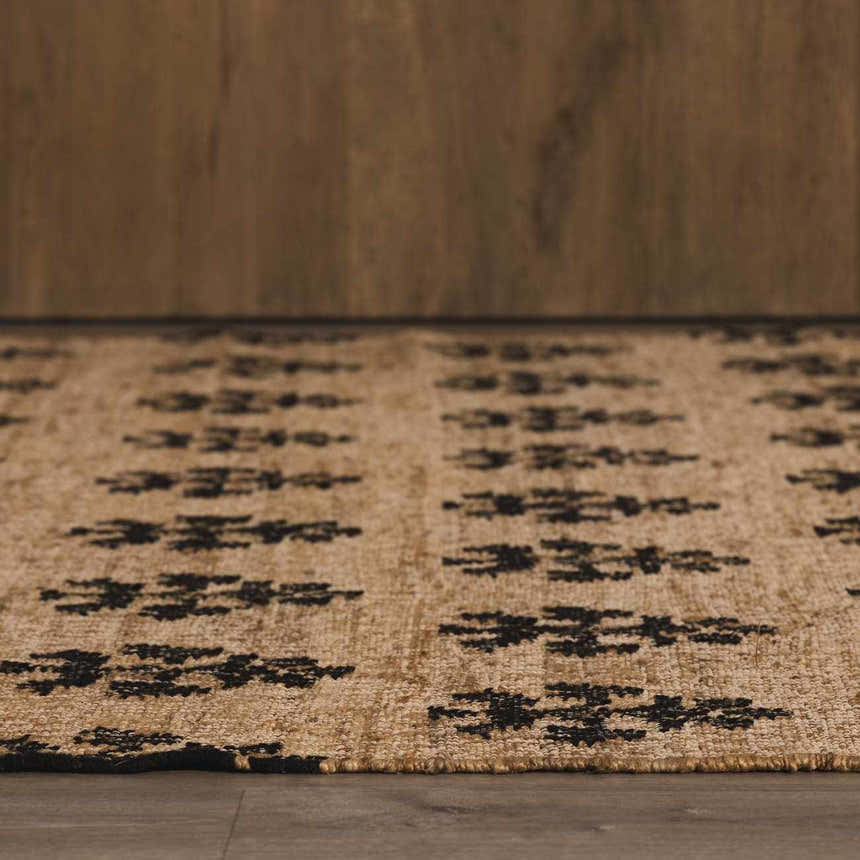 Close-up of the Albina Florentine Jute&Wool Rug. Jute texture with a black geometric pattern. Hand woven rug. Roomscene-Rectangle