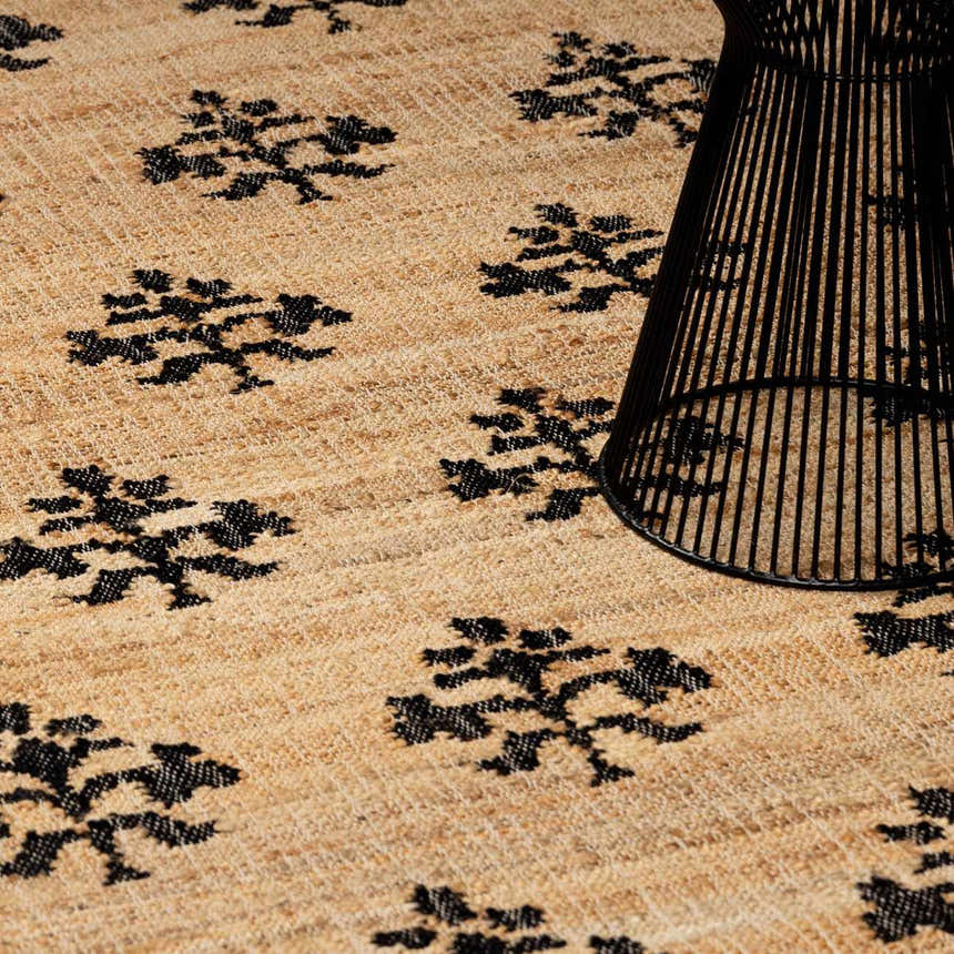 Close-up of the Albina Florentine Jute & Wool Rug, showcasing its black tree pattern on a textured jute background. Styleshot