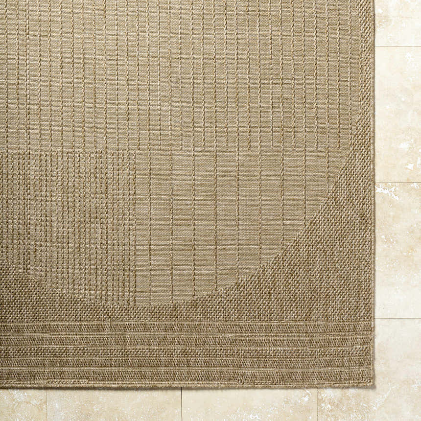 Close-up of textured Yuley Brown Area Rug in prairie dust and tan, with a machine-woven, transitional design. Corner