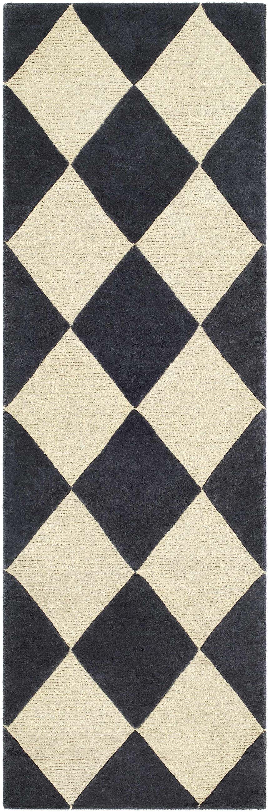 Close-up of the Aradia Charcoal Area Rug. Features a bold, geometric diamond pattern in charcoal and cream. Hand-tufted wool texture. Design-Runner-268