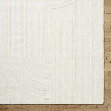 Close up of the light silver Alayja Area Rug showing the contemporary geometric design and wool texture. Swatch