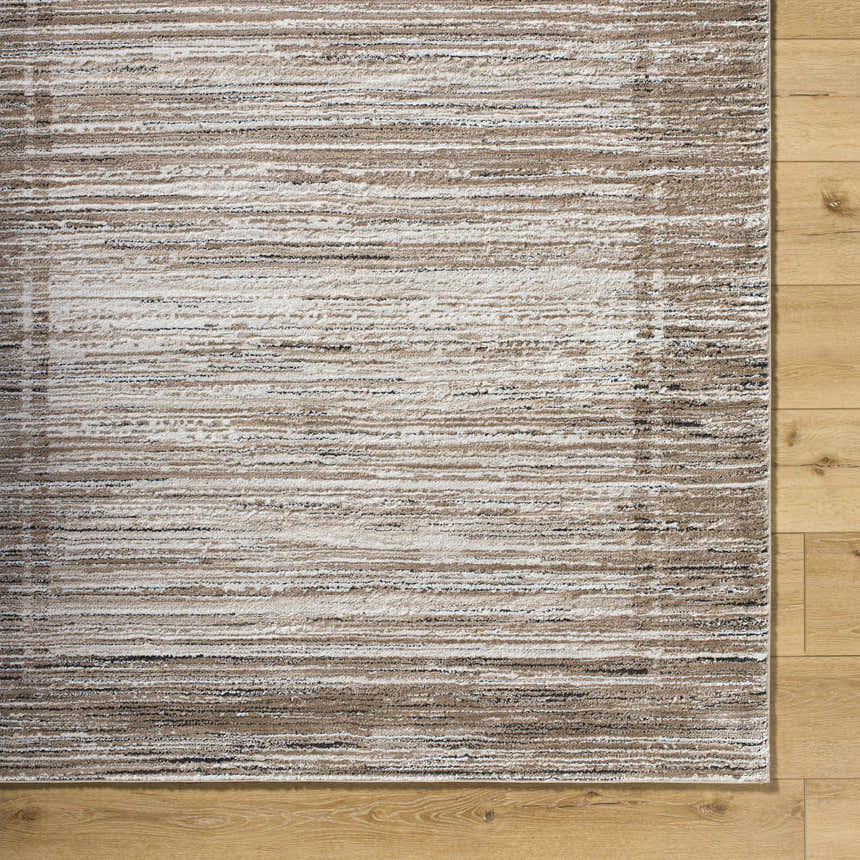 Close-up of the Ainhoa Luxe Thick Area Rug. Contemporary design in ivory, tan, and black on wood floor. Swatch