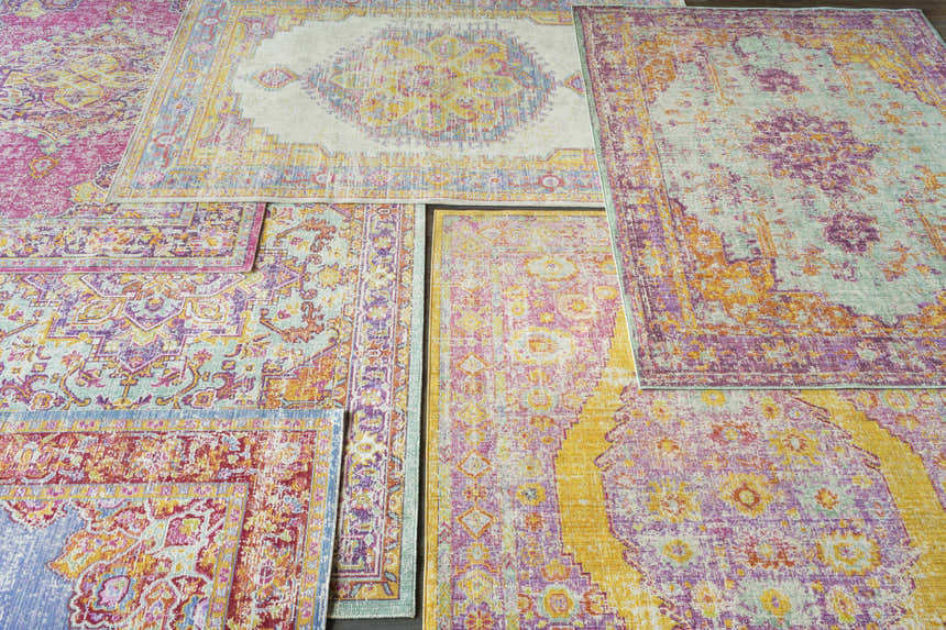 Horley Area Rugs: Variety of farmhouse, traditional style rugs in pink, yellow, orange, and blue hues. Styleshot