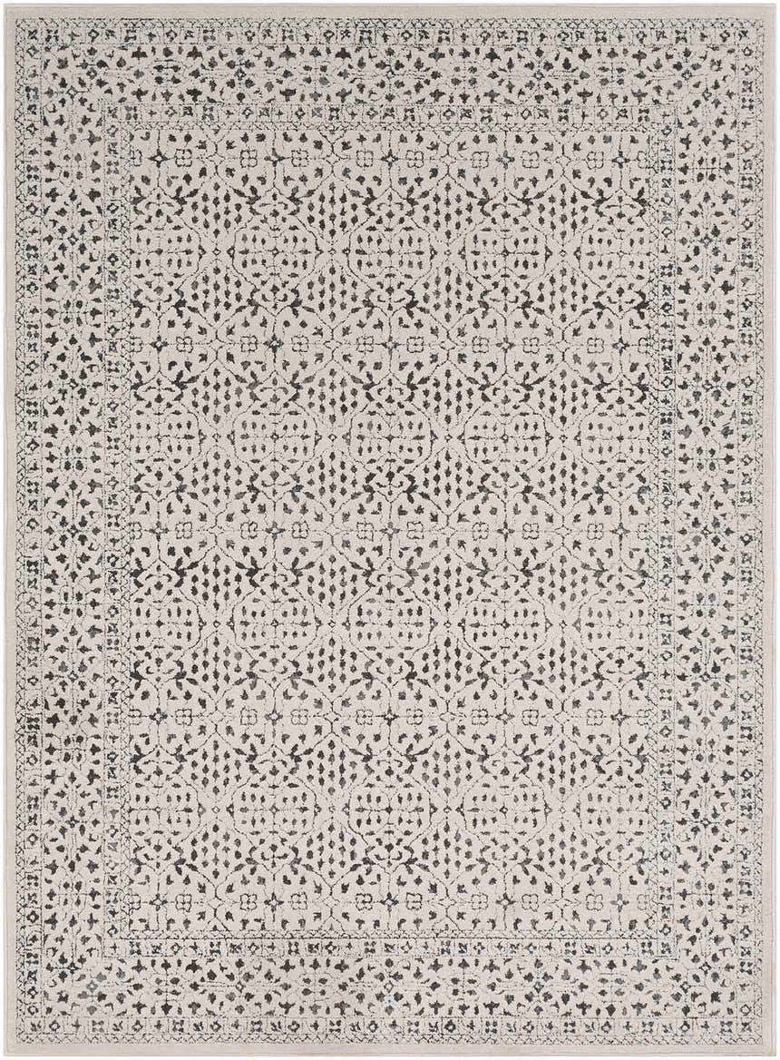 Close-up of Sattley Area Rug. Beige rug with charcoal, floral-inspired, geometric pattern and traditional border. Design-Rectangle-5373