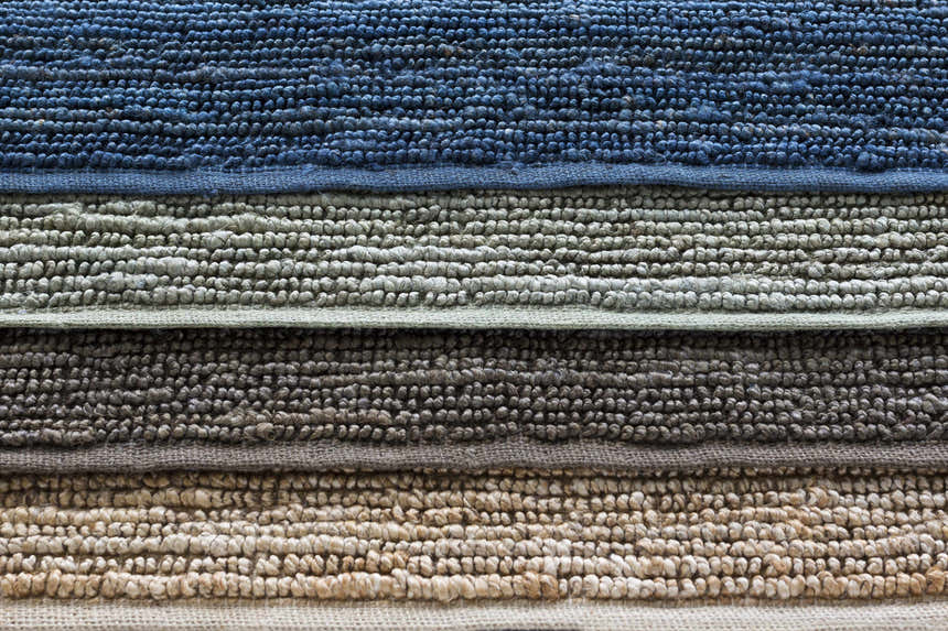 Close-up of the braided texture and color variations of the Glover Sage Jute Carpet. Hand woven rug detail. Styleshot