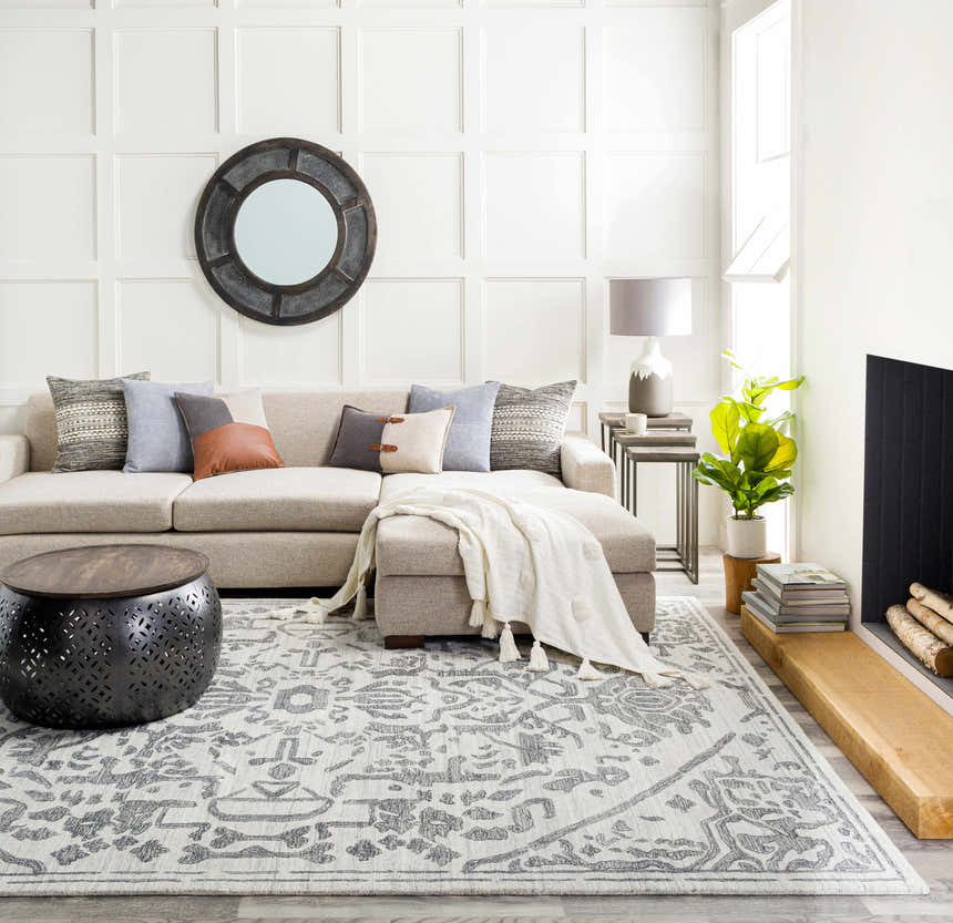 Living room with a light gray sectional sofa and black Darfield Area Rug. Roomscene-Rectangle