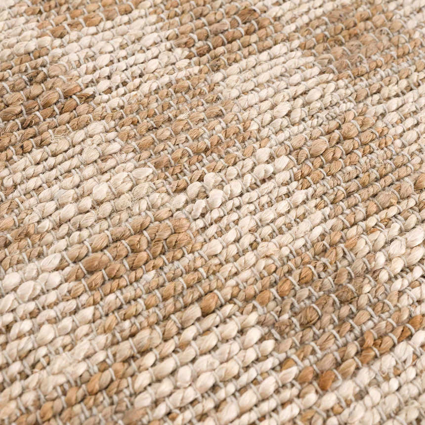 Close-up of the hand woven Ionut Checkered Jute Area Rug. Beige and tan jute fibers create a textured, checkered pattern. Texture