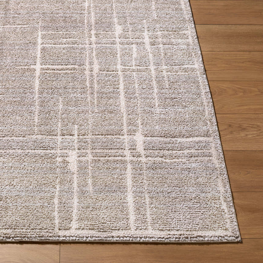 Close-up of Alma Machine Woven Elle Decor x LIVABLISS EDAL-2304 Area Rug in medium brown and taupe with a geometric pattern. Front