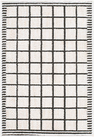 Close-up of the Civie Cream Geometric Area Rug. Features a black grid pattern on a cream, textured polyester. Contemporary style. Design-Rectangle-221